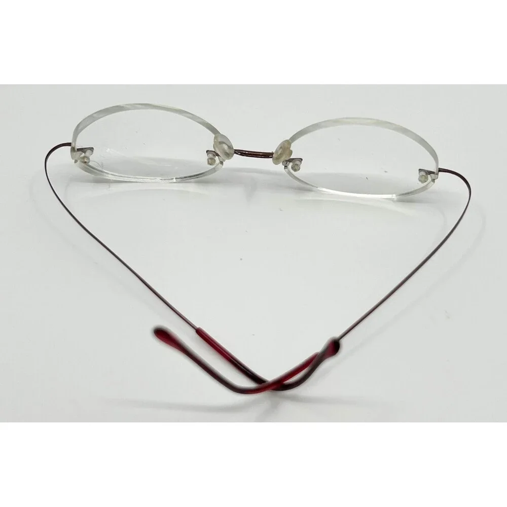 Dollar Optical Eyeglasses Unisex Red Beta Titanium Rimless Oval BT 2000 150